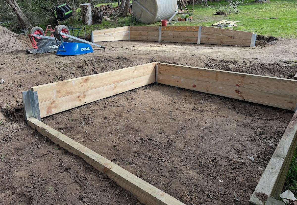 A professionally built concrete sleeper retaining wall.